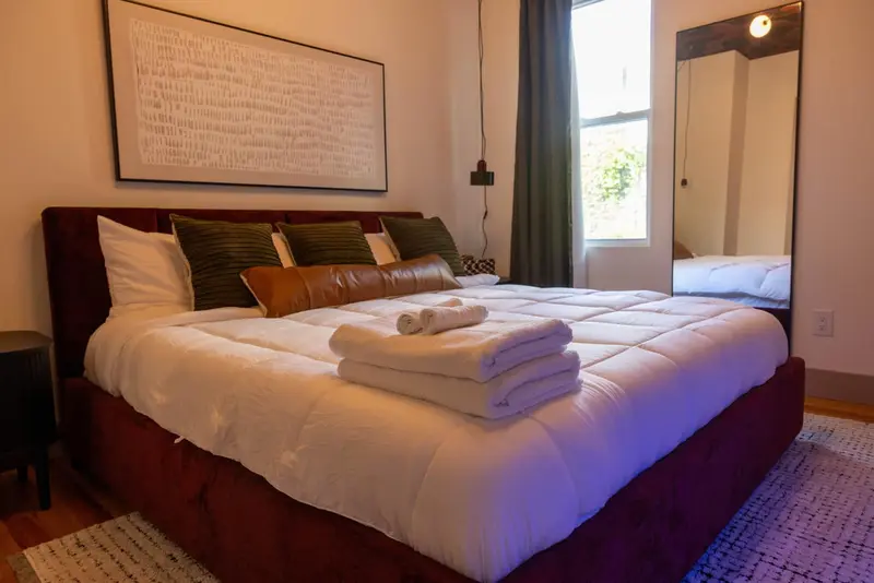 King size bedroom with walking closet and attached bathroom, The Mulberry Loft vacation rental in Jersey City near NYC