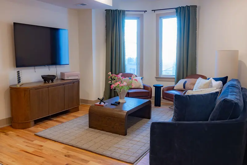 Spacious Living Space. TV console has some board games, Duplex Olive House vacation rental in Jersey City near NYC